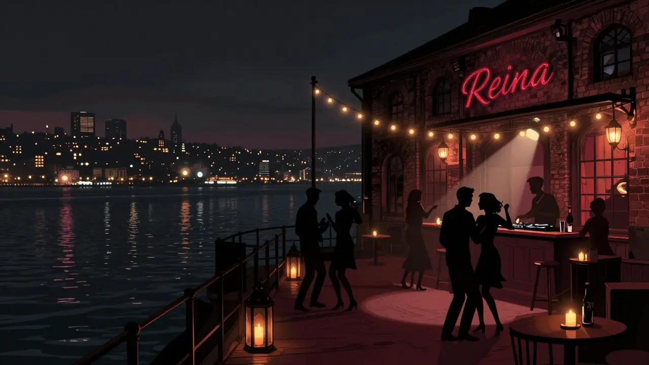 Reina nightclub on the Bosphorus at night, guests dancing on a deck with city lights reflecting on water.